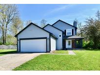 Charming two-story home with gray siding, black trim, and a two-car garage showcasing its curb appeal at 609 Delray Dr, Indianapolis, IN 46241