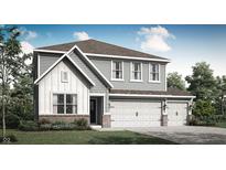 Charming two-story home featuring a three-car garage and inviting curb appeal with landscaping at 7608 Allesley Dr, Avon, IN 46123