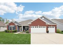 Charming brick and gray two-story home with well-maintained lawn and a two-car garage at 9359 Foudray N Cir, Avon, IN 46123
