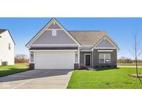 Charming single-Gathering home with gray siding, a two-car garage and well manicured front lawn at 10250 Camp Creek Way, Indianapolis, IN 46229
