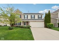 Charming two-story home featuring brick accents, a two-car garage, and a well-manicured front lawn at 3430 Burlingame Blvd, Westfield, IN 46074