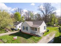 Charming single-story home featuring a welcoming front porch and fresh landscaping at 3511 N Keystone Ave, Indianapolis, IN 46218