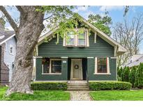 Charming two-story home with a well-maintained lawn and professional landscaping at 4917 N Park Ave, Indianapolis, IN 46205