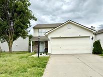 Charming two-story home featuring vinyl siding, a two-car garage, and a well-maintained front yard at 5411 Cliff Ridge Dr, Indianapolis, IN 46217