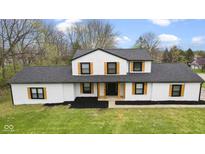 Aerial view of a charming home with lush green lawn, and eye-catching trim at 8315 N Payne Rd, Indianapolis, IN 46268