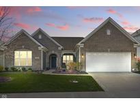 Charming brick home with a well-manicured lawn and inviting front entrance at 1275 Cliff View Dr, Westfield, IN 46074