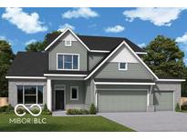 Charming two-story home showcasing a harmonious blend of gray siding and brick accents, complemented by a lush green lawn at 15835 Vitalize Run, Fishers, IN 46040