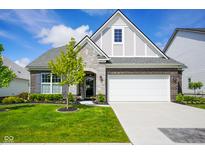 Charming two-story home with a two-car garage, manicured lawn, and beautiful landscaping at 2250 Somerset Dr, Franklin, IN 46131