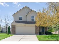 Charming two-story home featuring a brick and vinyl facade, attached garage, and well-manicured lawn at 4625 Elkhorn Ct, Noblesville, IN 46062