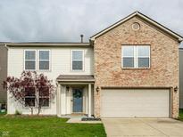 Charming two-story home with a brick facade and well-maintained lawn at 8269 S Midnight Dr, Pendleton, IN 46064