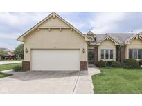 Charming single-Gathering home with a two-car garage, manicured lawn, and traditional design elements at 948 Peppermill Run, Greenwood, IN 46143