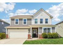 Charming two-story home with a front yard, attached garage, and inviting curb appeal at 10358 Pronghorn Ln, Indianapolis, IN 46239