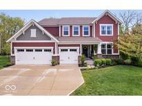 Beautiful two-story home featuring a three-car garage and well-manicured lawn at 10531 Cleary Trce, Fishers, IN 46040