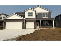 Two-story home featuring a two-car garage, brick and vinyl siding, and white trim at 2698 Nampa Dr, Whitestown, IN 46075