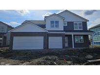 New two-story home showcasing a brick and siding facade with a two-car garage, plus bright white trim at 2698 Nampa Dr, Whitestown, IN 46075