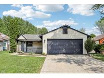 Charming single-Gathering home with a spacious two-car garage and well-maintained lawn at 5323 Shefford Ct, Indianapolis, IN 46254