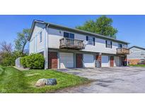 Charming townhome featuring brick accents and small elevated decks at 6814 Summer Time Dr, Indianapolis, IN 46226