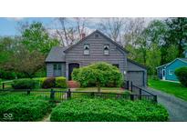 Charming gray two-story home with a landscaped front yard, attached garage, and inviting curb appeal at 901 Center Dr, Noblesville, IN 46060
