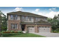 A charming, two-story home with a landscaped yard, neutral siding, and a three car garage at 11641 Aubrey Ln, Fishers, IN 46040