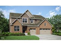 A charming two-story home with a brick and siding facade and an attached two-car garage at 11682 Aubrey Ln, Fishers, IN 46040