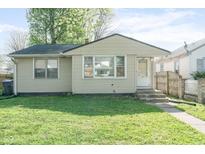 Cozy one-story home featuring a well-maintained lawn and inviting front entrance at 1725 Medford Ave, Indianapolis, IN 46222