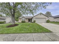 Charming single-Gathering home with a well-manicured lawn and a two-car garage at 17752 Sanibel Cir, Westfield, IN 46062