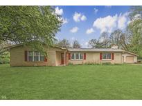 Charming single-story brick home featuring a well-manicured lawn and red window shutters at 3008 Old State Road 37, Greenwood, IN 46143