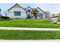 Beautiful two-story home with a manicured lawn, stone accents, and a welcoming front porch at 728 Christin Ct, Plainfield, IN 46168