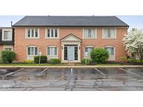 Attractive brick building with accessible parking spots and blue door at 1151 Canterbury Ct # D, Indianapolis, IN 46260