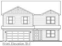 Front elevation of a two-story home with siding and a two-car garage at 1216 Mcbride St, Greenfield, IN 46140