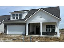 Charming single-story home features a stone accent garage and covered front porch at 14913 Higgins Dr, Westfield, IN 46074