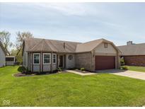 Charming single-story home with well-manicured lawn and attached two-car garage at 177 Tracy Ridge Blvd, Whiteland, IN 46184