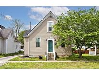 Charming home featuring a classic exterior and a beautiful, mature tree in the front yard at 312 S Center St, Plainfield, IN 46168
