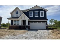 Charming two-story home featuring navy siding, white trim, and a spacious two-car garage at 3932 Andean Ct, Bargersville, IN 46106