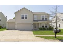 Charming two-story home featuring a two-car garage and well-maintained front lawn at 5646 Skipping Stone Dr, Indianapolis, IN 46237