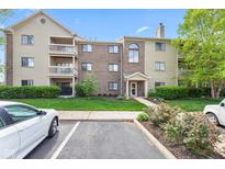 Attractive condo building with manicured lawn and inviting entrance, enhancing curb appeal at 8720 Yardley Ct # 100, Indianapolis, IN 46268