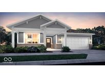 Charming single-Gathering home featuring a welcoming porch, gray siding, brick accents, and a two-car garage at 9341 Corbett Dr, McCordsville, IN 46055