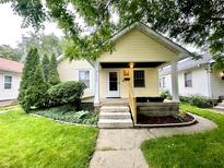 Charming single-Gathering home with a welcoming front porch and well-maintained landscaping at 1309 N Colorado Ave, Indianapolis, IN 46201