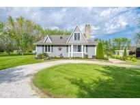 Charming home with updated exterior, stone chimney, and well-maintained yard with mature trees at 171 Williams Trce, Plainfield, IN 46168