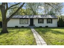 Charming home featuring a walkway, well-maintained lawn, and inviting curb appeal at 1903 Danbury Dr, Indianapolis, IN 46231