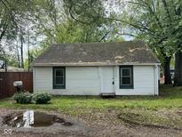Charming single-story home with white siding, green trim, and a well-maintained front yard at 2271 Park Ave, Columbus, IN 47201
