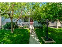 Charming home with a well-maintained front yard, sidewalk, and welcoming porch at 2306 Alabama St, Indianapolis, IN 46205