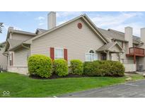Charming home with well-maintained landscaping and neutral siding, creating curb appeal at 3006 Wildcat Ln, Indianapolis, IN 46203