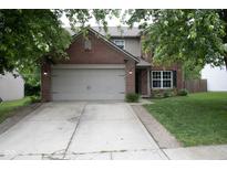 Charming two-story brick home with a well-maintained lawn and attached two-car garage at 8912 Hosta Way, Indianapolis, IN 46113