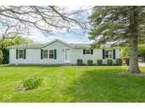Charming single-story home with a well-manicured front yard and mature trees enhancing its curb appeal at 1683 W County Road 300 S, Danville, IN 46122