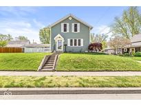 Charming two-story home features a well-manicured lawn and classic architectural details at 315 W High St, Pendleton, IN 46064