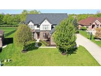 Stunning two-story brick home with well-manicured lawn and mature trees at 5942 Tioga Ct, Bargersville, IN 46106