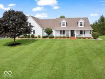 Charming two-story home with a large front yard and inviting porch at 6086 W 850 S, Edinburgh, IN 46124
