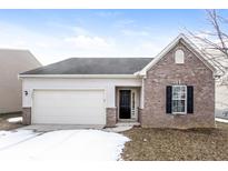 Charming single-Gathering home with brick accents, attached garage, and manicured lawn at 15447 Gallow Ln, Noblesville, IN 46060