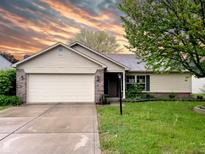 Charming single-story home with a brick and vinyl facade and an attached two-car garage at 2154 Walnut Meadow Ct, Indianapolis, IN 46234